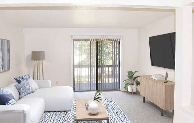 living room with a sliding glass door at Seville Apartments in Kalamazoo, MI 49009
