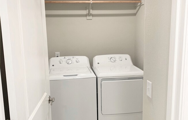 B2 (2-car) Laundry with side by side washer and dryer