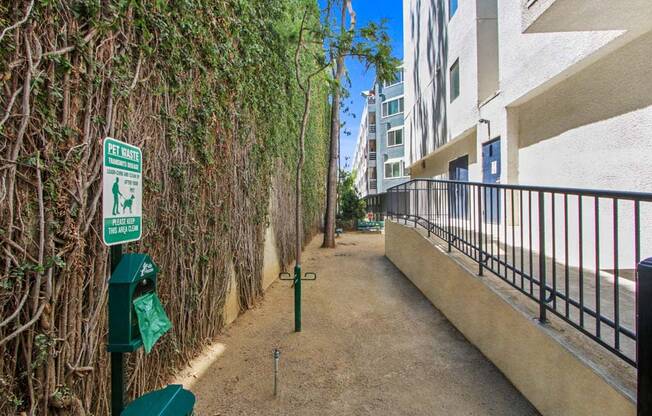 a walkway next to an apartment building  at Masselin Park West, California