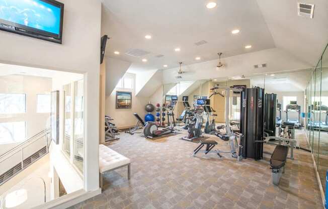 This is a photo of the 24-hour fitness center at The Brownstones Townhome Apartments in Dallas, TX.