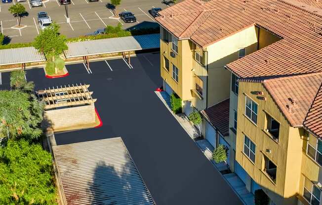 an aerial view of an empty parking lot in a residential neighborhood