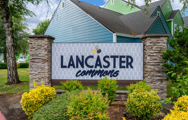 a large sign that says lancaster communities in front of a house