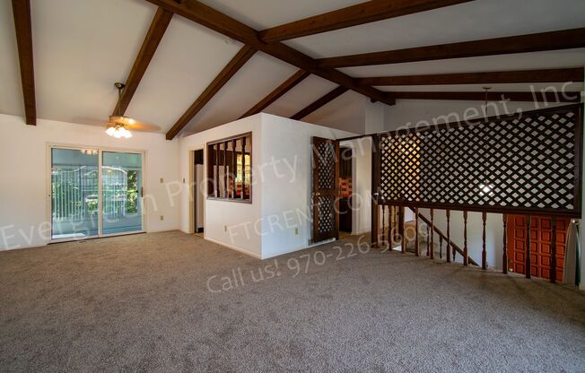 Charming Bi-Level Home in Desirable Mission Hills with a Sunroom, A/C and a Fireplace!