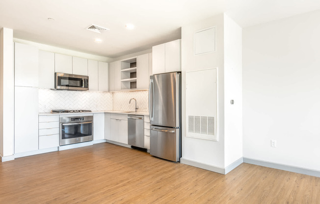 The Flats - Kitchen with Stainless Steel Appliances and Granite Countertops