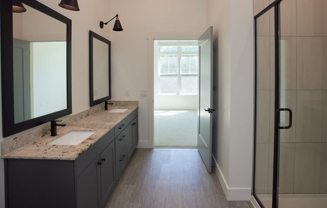 Bathroom With Double Vanity and Hard Surface Flooring