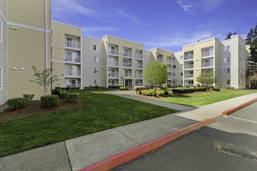 a view of the exterior of a building at the whispering winds apartments in pearland, tx  at Camelot Apartment Homes, Everett, 98204