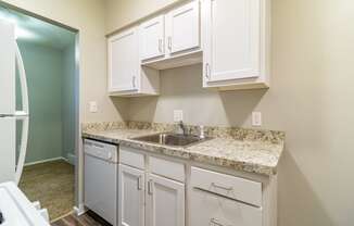 White kitchen with stainless steel sink