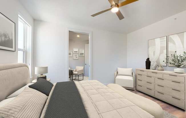 a bedroom with a large bed and a ceiling fan