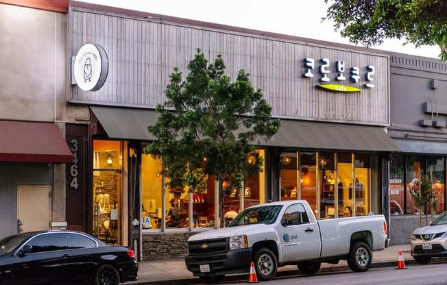 a white truck parked in front of a store