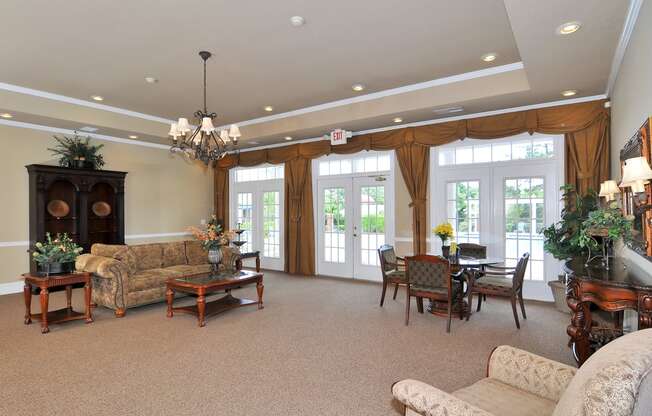 Resident lounge area with sofa coffee table and large French door leading to outside