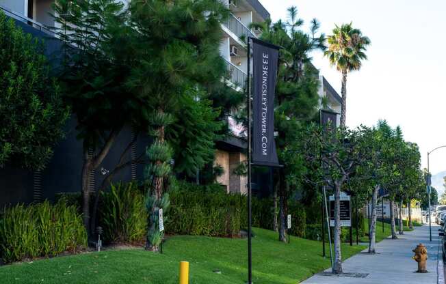 a sign in front of an apartment building