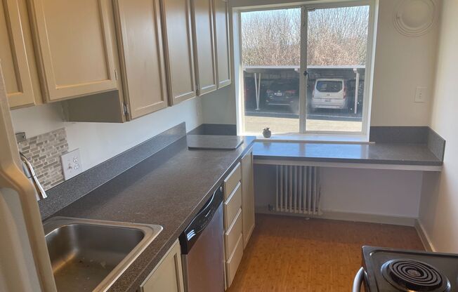 Cute and Cozy East Queen Anne Condo with 2 Bedrooms, 1 Bath and 1 Covered Parking Space