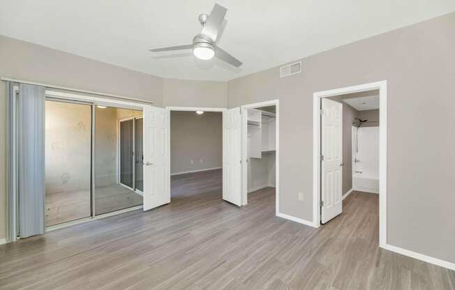 a view of a room with mirrored closets