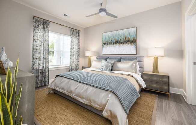 a bedroom with a bed and a ceiling fan