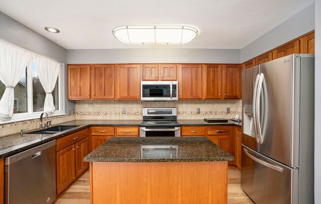 Spacious 4-Bedroom Home in District 20 with Huge Deck & Fenced Yard
