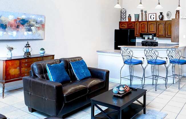 Gates de Provence clubhouse has a small kitchen and a seating area in front of a tv for residents to enjoy!