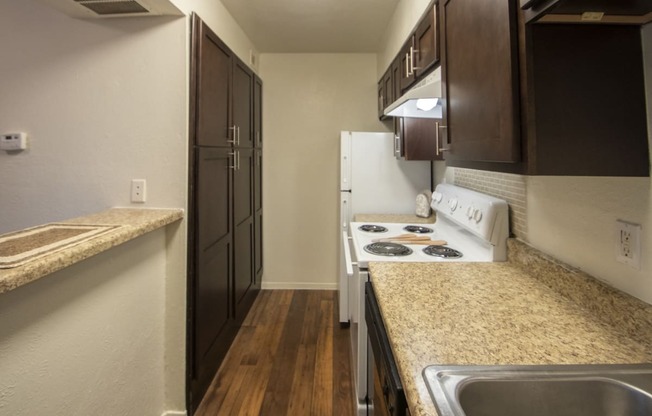 This is a photo of the kitchen of a fully upgraded 554 square foot 1 bedroom apartment at The Biltmore Apartments in Dallas, TX.