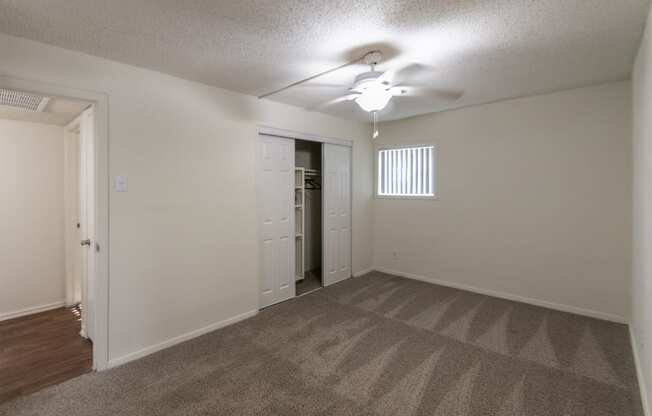 This is a photo of the primary bedroom in the 871 square foot 2 bedroom, 2 bath apartment at Princeton Court Apartments in the Vickery Meadow neighborhood of Dallas, Texas.