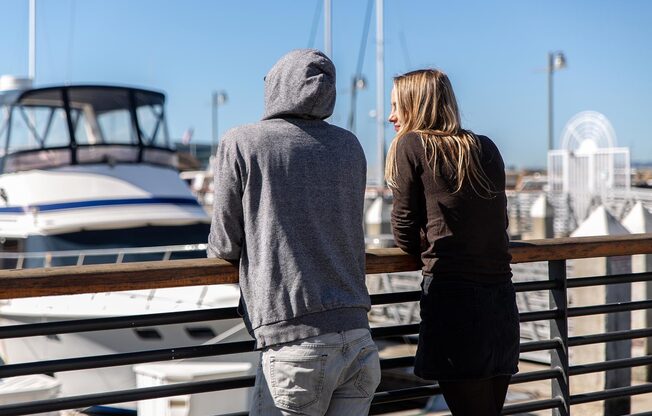 two people watching the boats