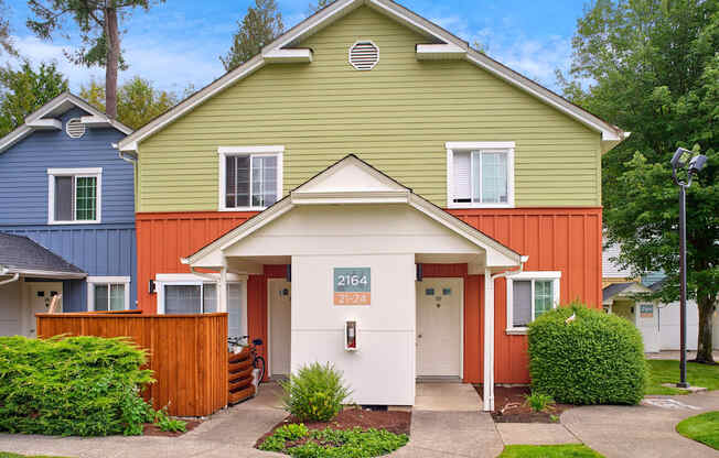 the front of a house with a porch and a sidewalk at Woodcreek, Poulsbo Washington 
