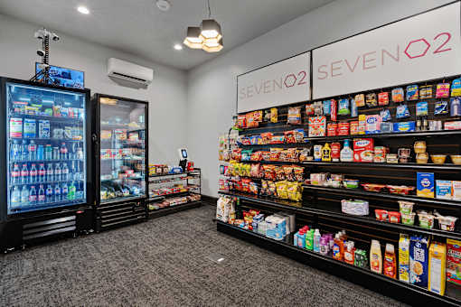 a convenience store with a large display of food and drinks at SevenO2 Main Apartments, Salt Lake City