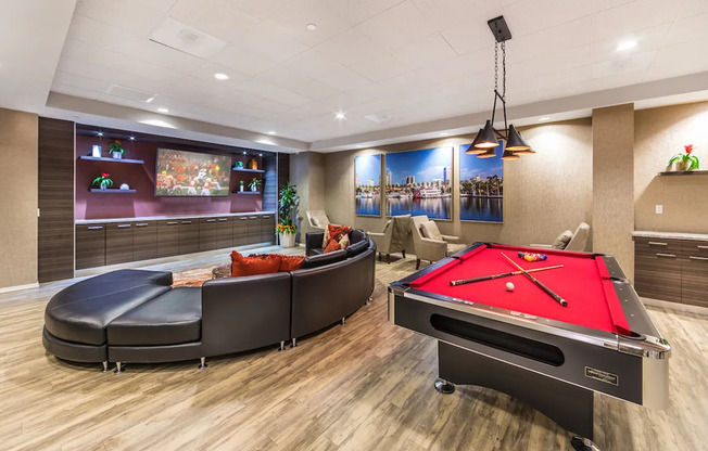Rec room with billiards, ping-pong table, lounge, and massive flat-screen TV