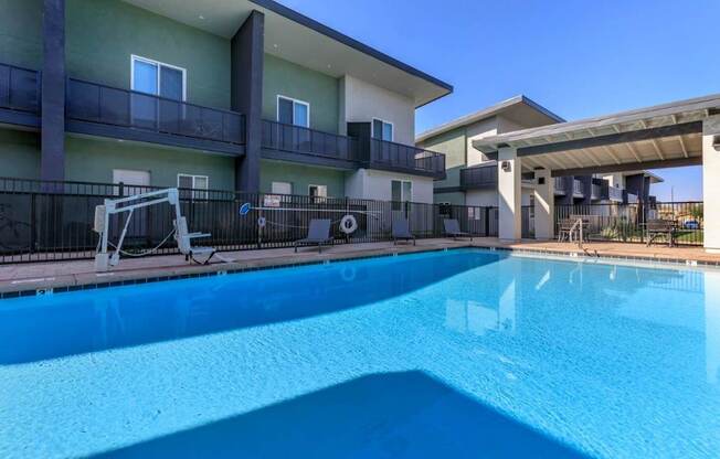 The Hedrick on Mountain Townhome-Style Apartments in Tucson, Arizona Pool with Lounge Chairs