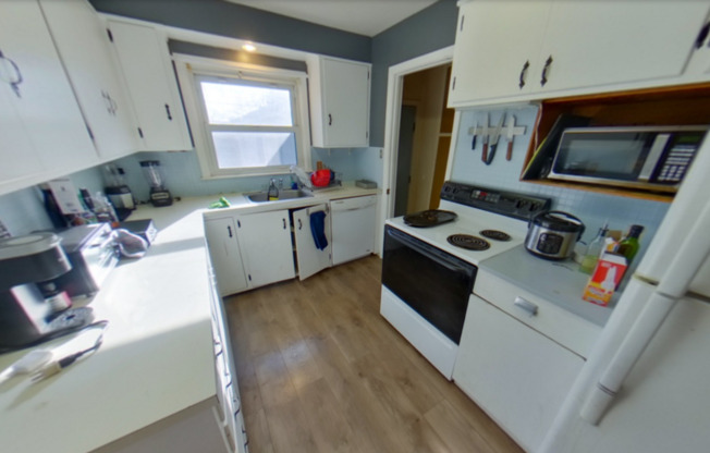 Fenced-in Backyard + Washer & Dryer Included + Off-Street Parking! Available August 1st!