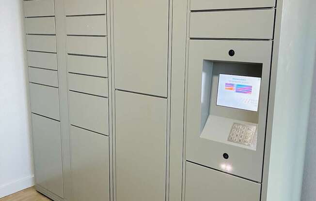 A row of lockers with a keypad on the right.