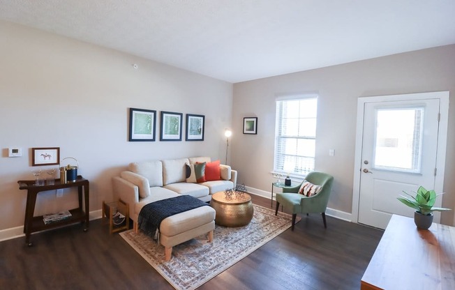 a living room with a couch and a chair