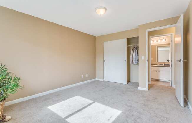 an empty living room with a closet and a bathroom at Springfield, Washington, 98055