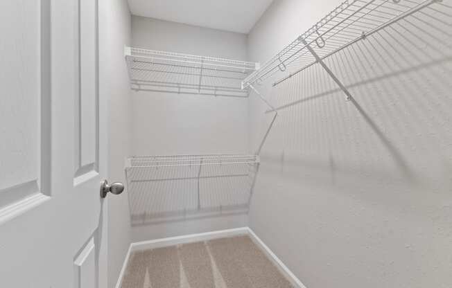 Spacious walk-in closets with shelves for extra storage space