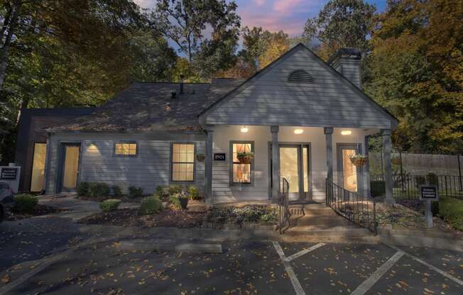 the front of a house with a porch and a driveway