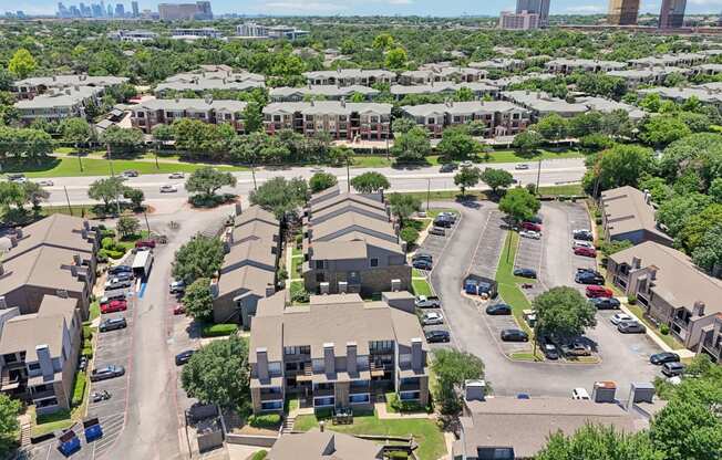 an aerial view of a neighborhood with houses and cars parked