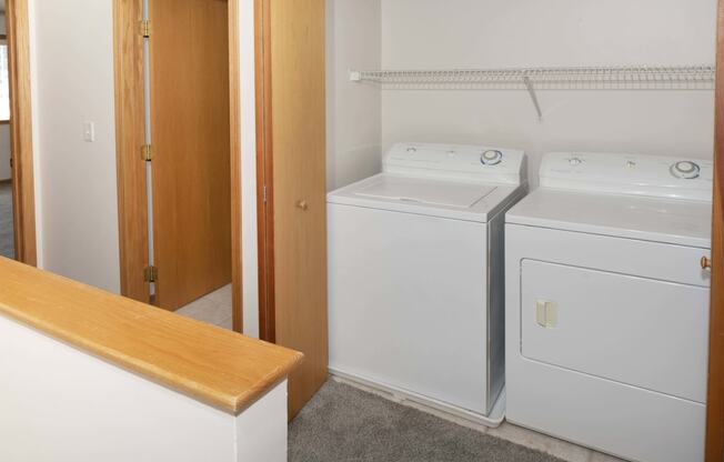 a small laundry room with a washer and dryer