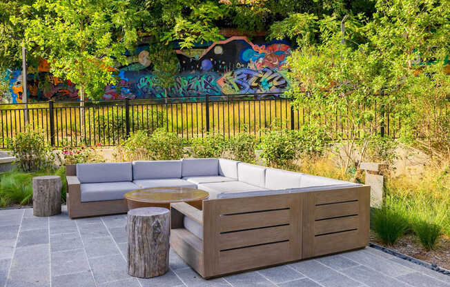 a seating area with a couch and a table on a patio at The Chase at Bryant Street, Washington, 20002