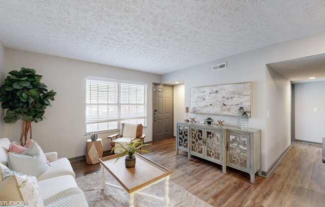 a living room with a couch and a table