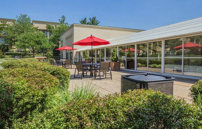 Outdoor Lounge With Umbrella Shades at Stuart Woods, Herndon, Virginia