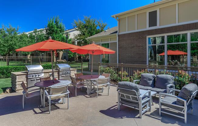 a group of lawn chairs sitting on top of a picnic table