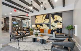 a lobby with couches and chairs and a coffee table