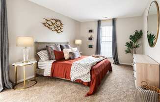 Two-Bedroom Apartments in Westerville, OH - Fairway Lakes - Spacious, Furnished Bedroom with Plush Carpet Flooring and Two Large Windows