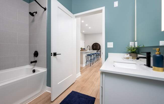 a bathroom with a bathtub and a sink