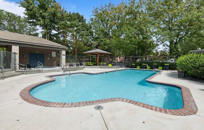 the preserve at ballantyne commons pool and spa with trees and a building