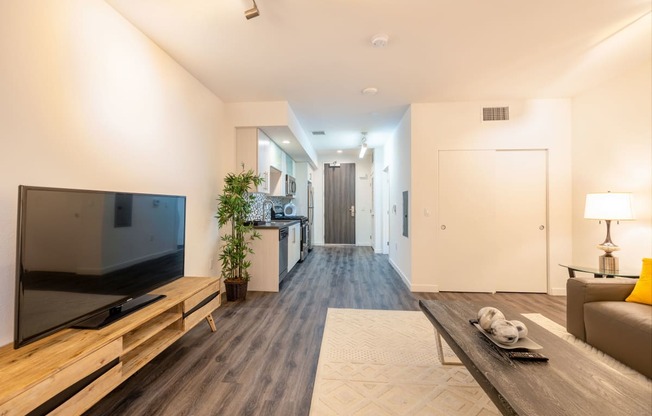 a living room with a couch and a tv