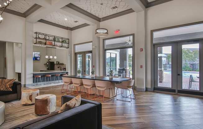 a large living room with a large dining room table and chairs at Sladestone Shadow Creek, Pearland