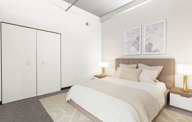 a bedroom with a bed and two white closets