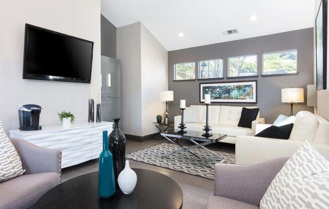 a living room with couches a table and a television at Skyline Heights LLC, Daly City