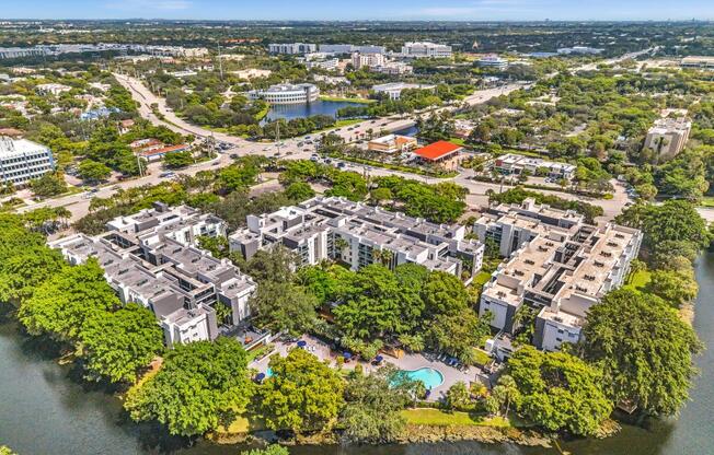 A bird's eye view of a residential area with a river running through it.
