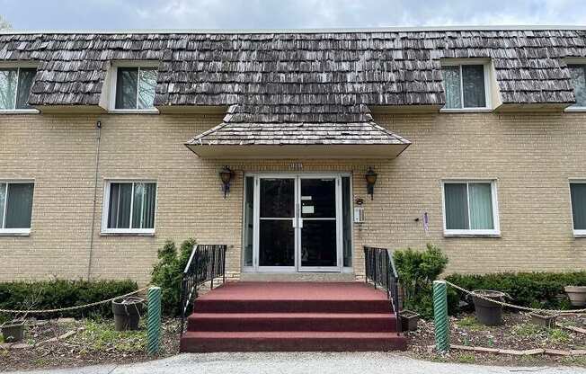 a building with a tile roof and a glass door