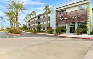The Standard hotel has a parking lot in front of it.
